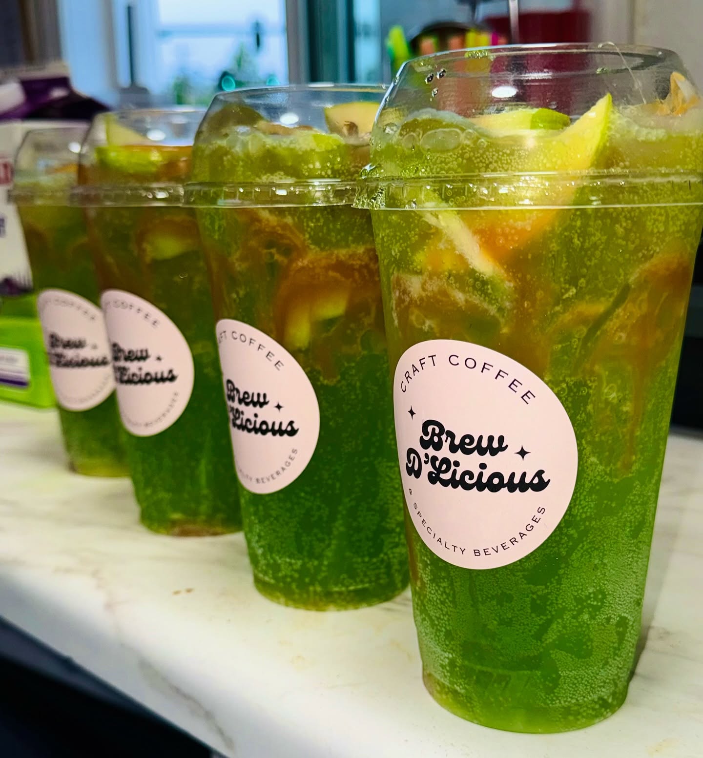 A lineup of green sparkling refreshers on the counter