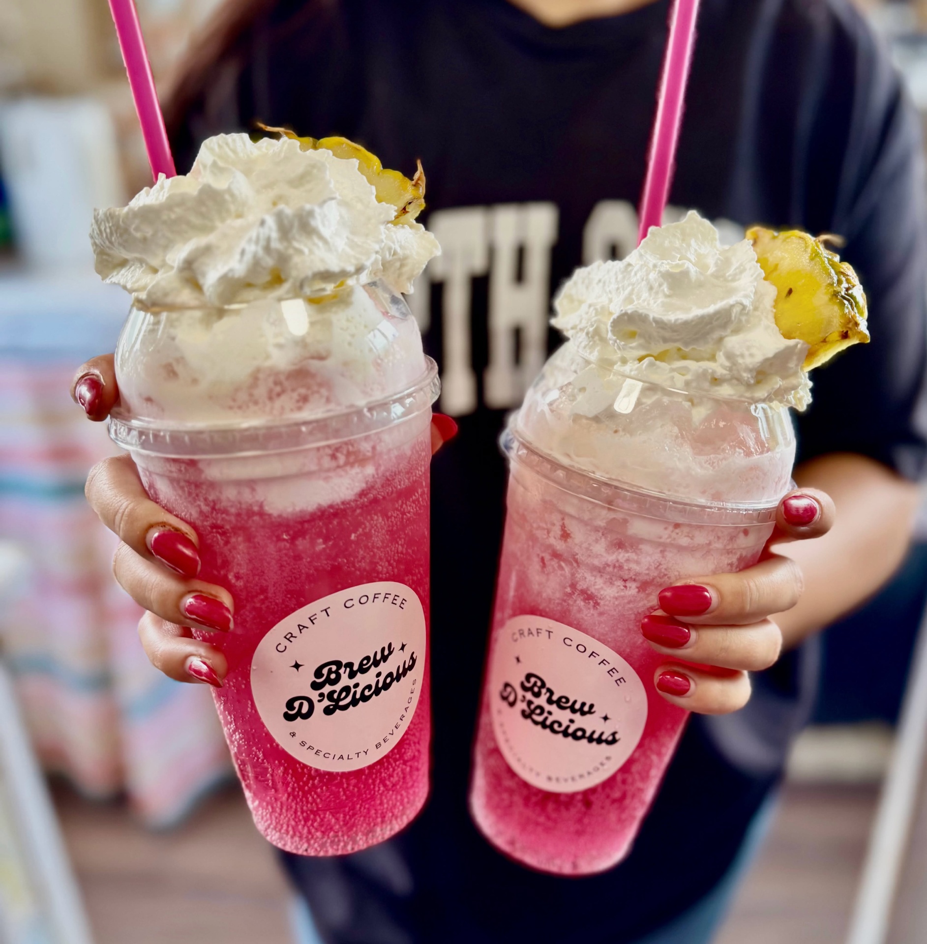 Two pink pineapple whip refreshers